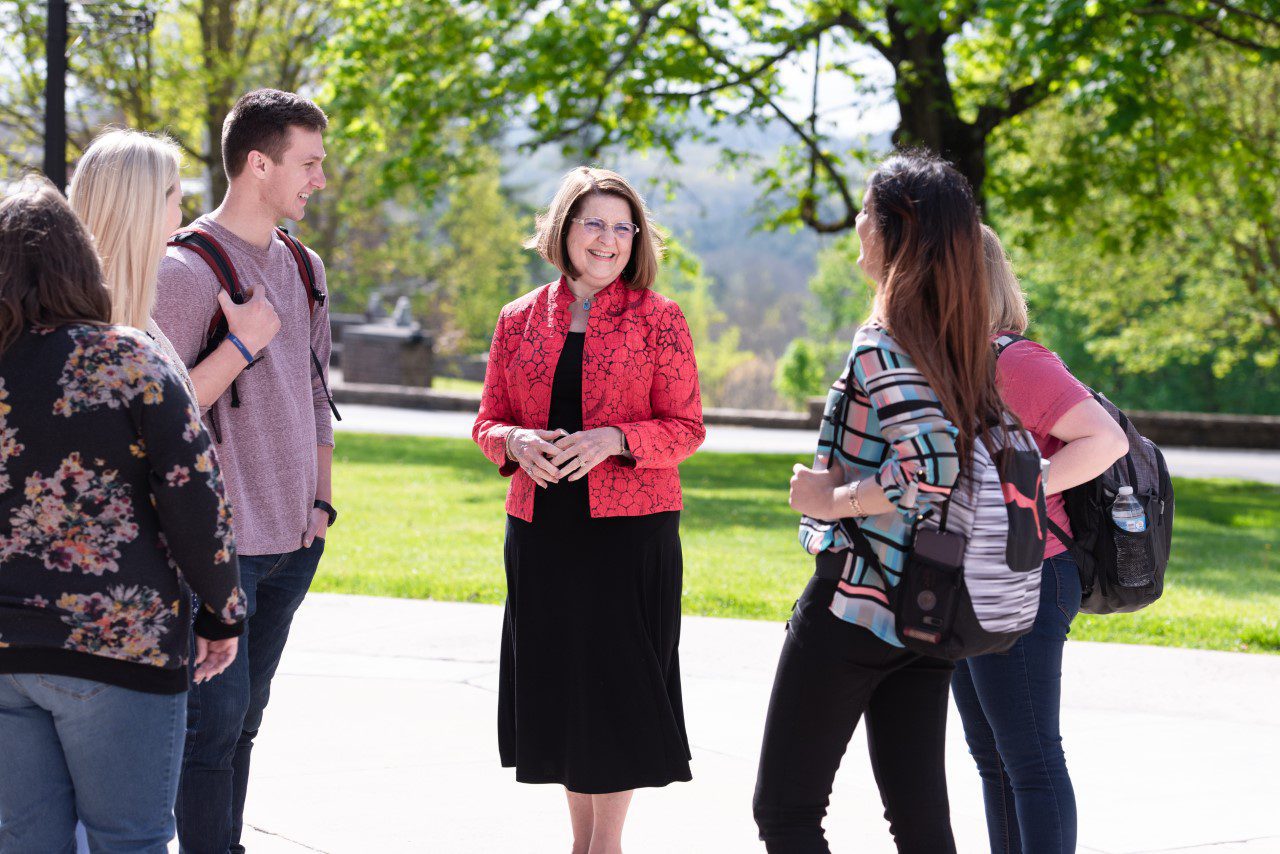 Concord University president Dr. Kendra S. Boggess talking to students on campus