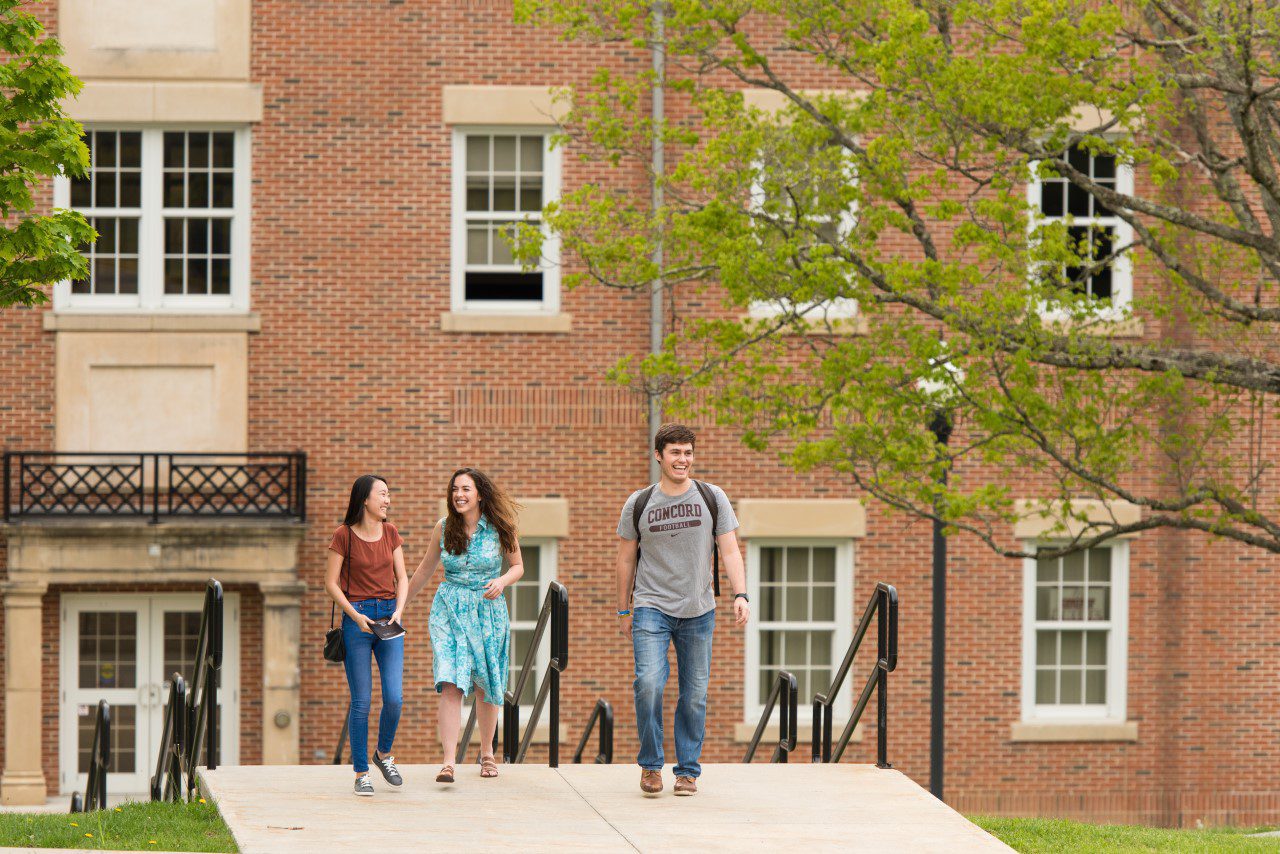 students walking up the stairs outside the Rahall building