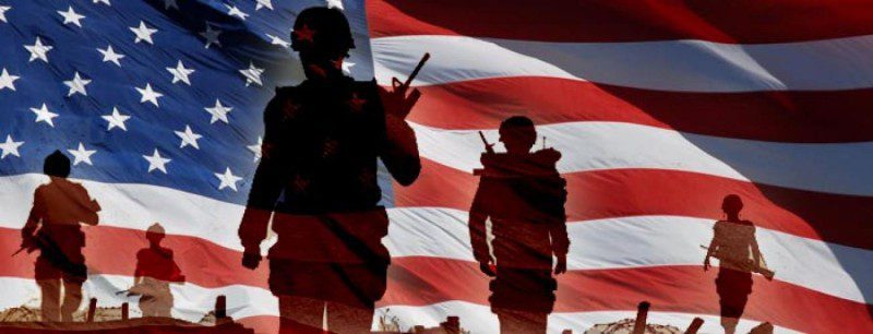 Silhouettes of US Veterans in front of the US flag