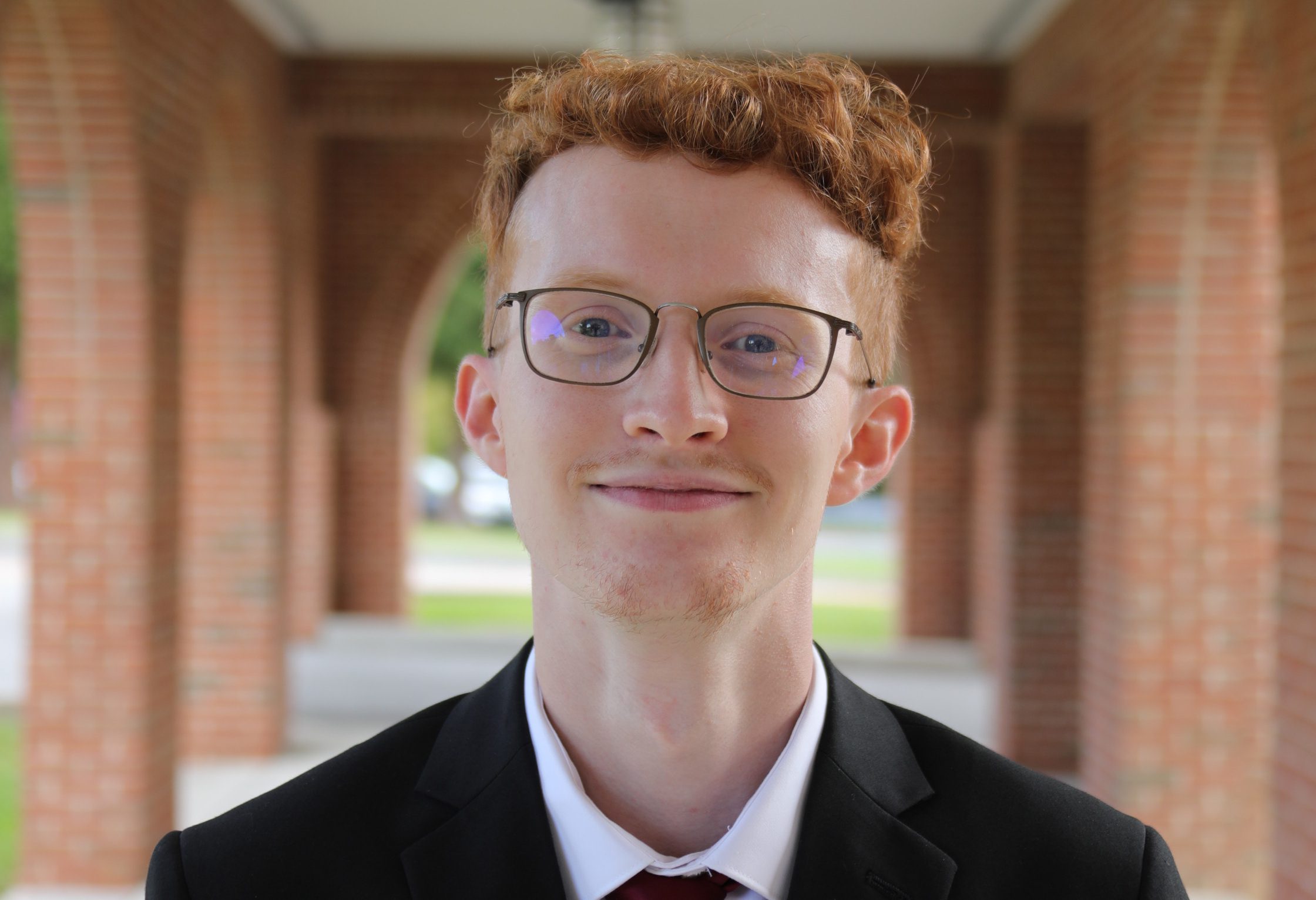 A photo of Nathan Lockhart in front of University Point at Concord University