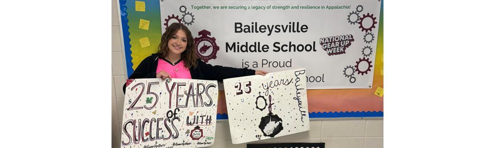 A Baileysville Middle School student holding GEAR UP SWV signs