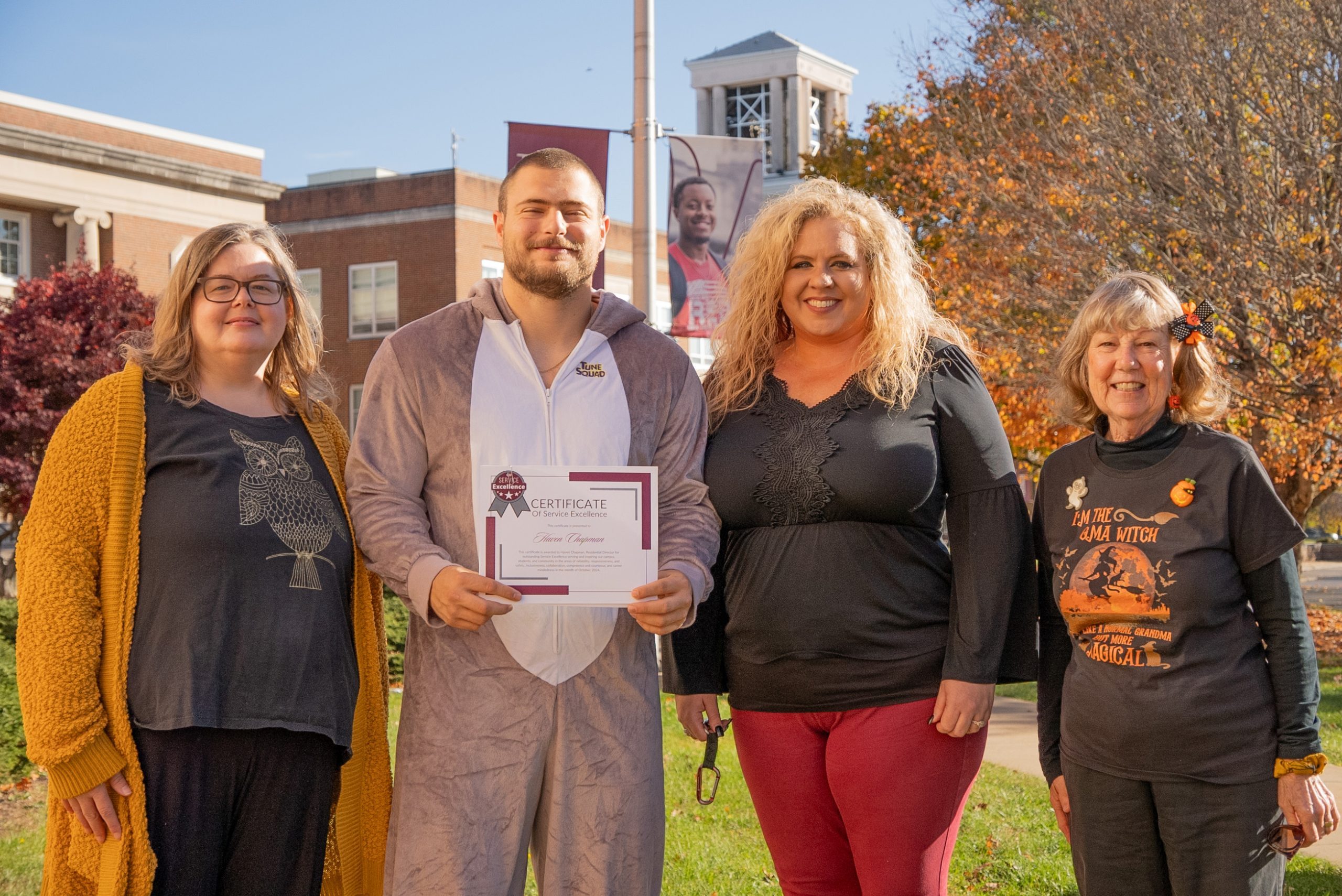 A group photo of Anna Hardy, Haven Chapman, Kristen Bailey, and Sharon Manzo on a bright fall day