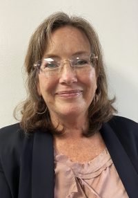 A photo of Tracy Dransfield in front of a white background