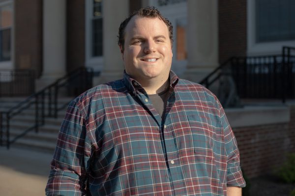 A photo of Lucas Skjaret standing in front of the J. Franklin Marsh Library at Concord University