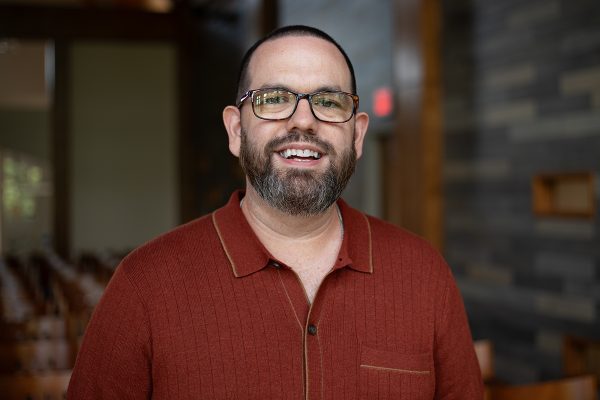 A photo of Shawn Allen seated inside University Point