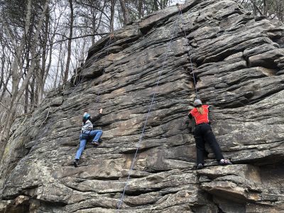 Two students rock climbing