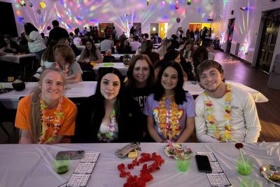 Students playing blacklight bingo in the Concord University ballroom