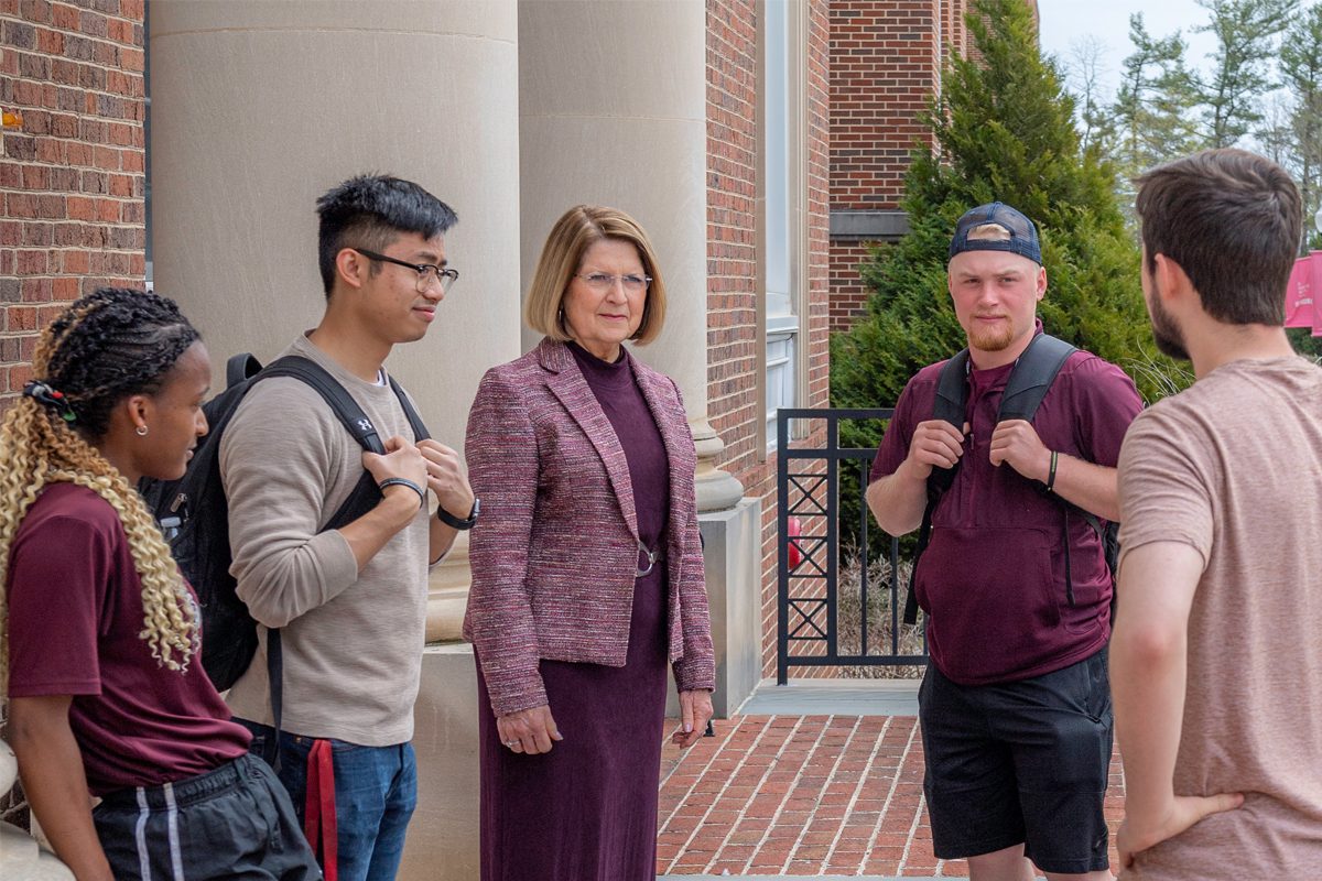 Concord University president Dr. Boggess talking to students outside the library